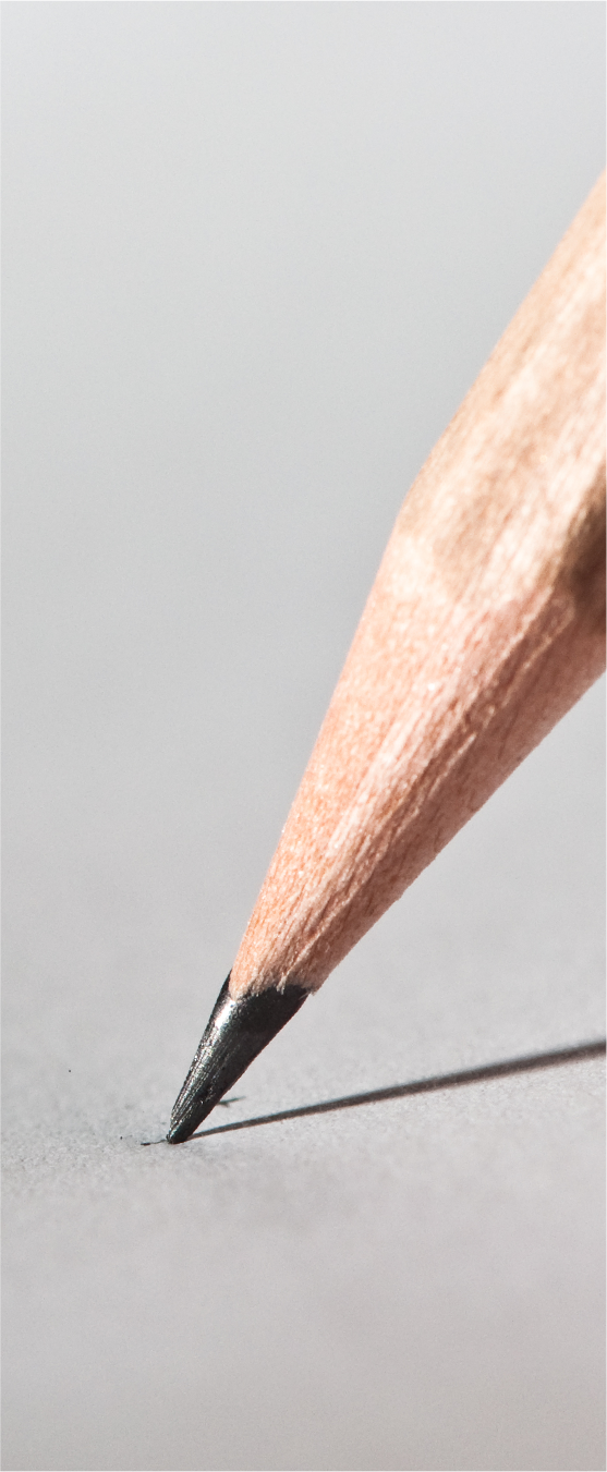 the end of a pencil on a piece of paper